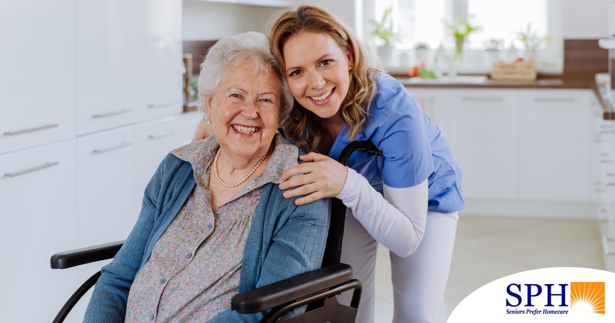 A caregiver enjoys her job as she smiles with a happy client representing the joy that can come from a home care career.